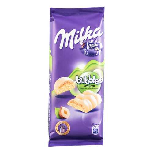 Шоколад белый пористый Milka bubbles с фундуком 83 г в Дикси